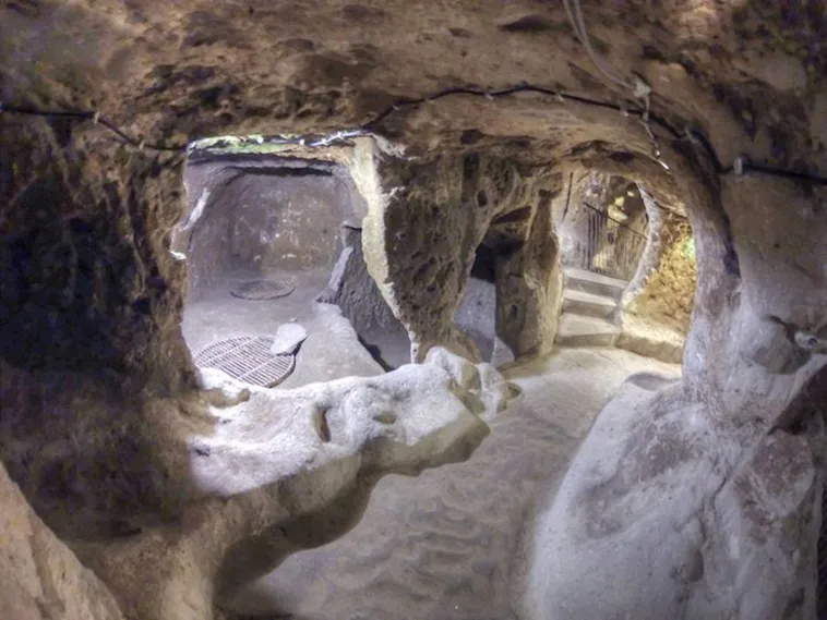 Explore the mysteries of Derinkuyu, the largest underground city housing 20,000 people. Delve into its rich history and ingenious design. Unearth a hidden world beneath Cappadocia's enchanting landscape.
