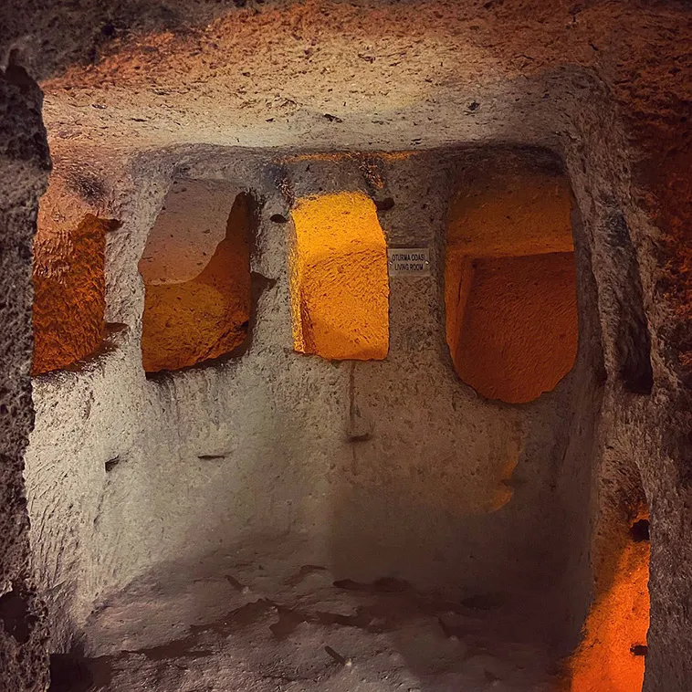 Explore the mysteries of Derinkuyu, the largest underground city housing 20,000 people. Delve into its rich history and ingenious design. Unearth a hidden world beneath Cappadocia's enchanting landscape.