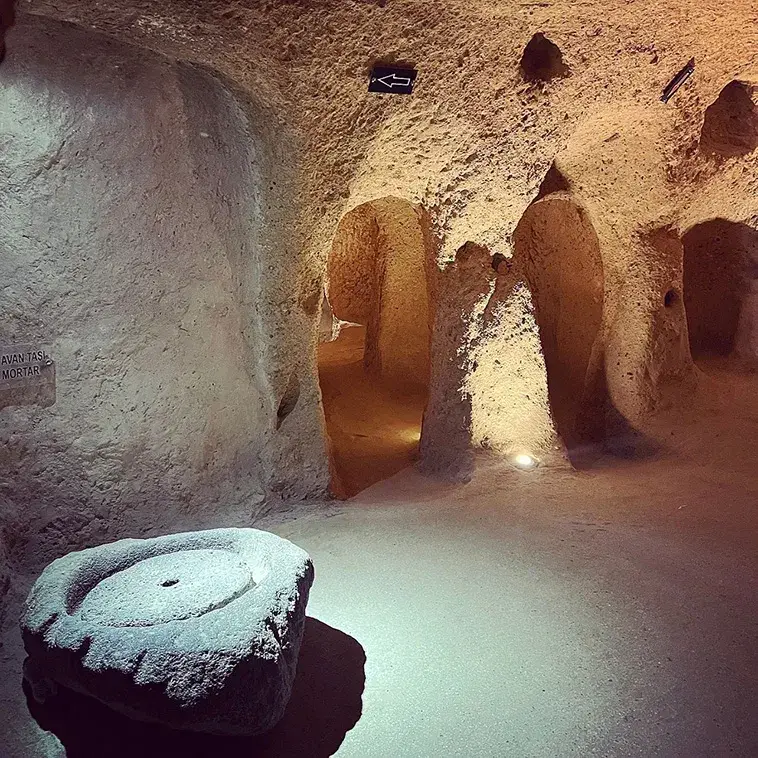 Explore the mysteries of Derinkuyu, the largest underground city housing 20,000 people. Delve into its rich history and ingenious design. Unearth a hidden world beneath Cappadocia's enchanting landscape.