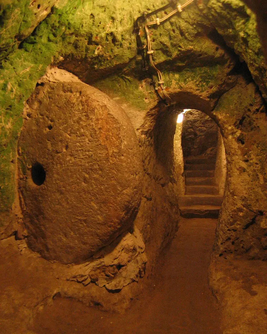 Explore the mysteries of Derinkuyu, the largest underground city housing 20,000 people. Delve into its rich history and ingenious design. Unearth a hidden world beneath Cappadocia's enchanting landscape.