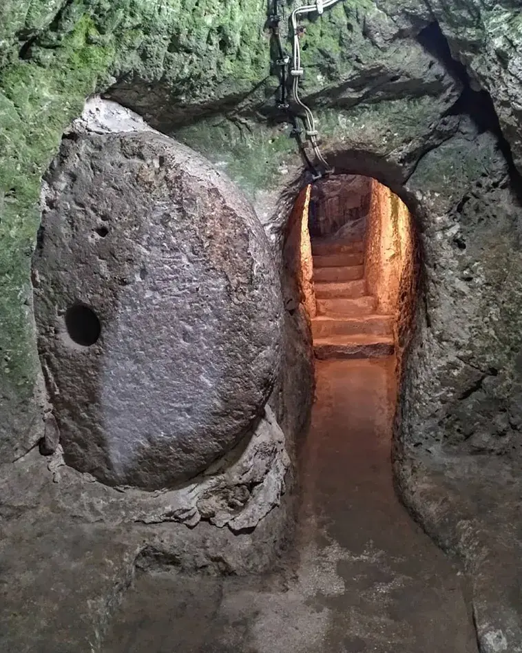 Explore the mysteries of Derinkuyu, the largest underground city housing 20,000 people. Delve into its rich history and ingenious design. Unearth a hidden world beneath Cappadocia's enchanting landscape.