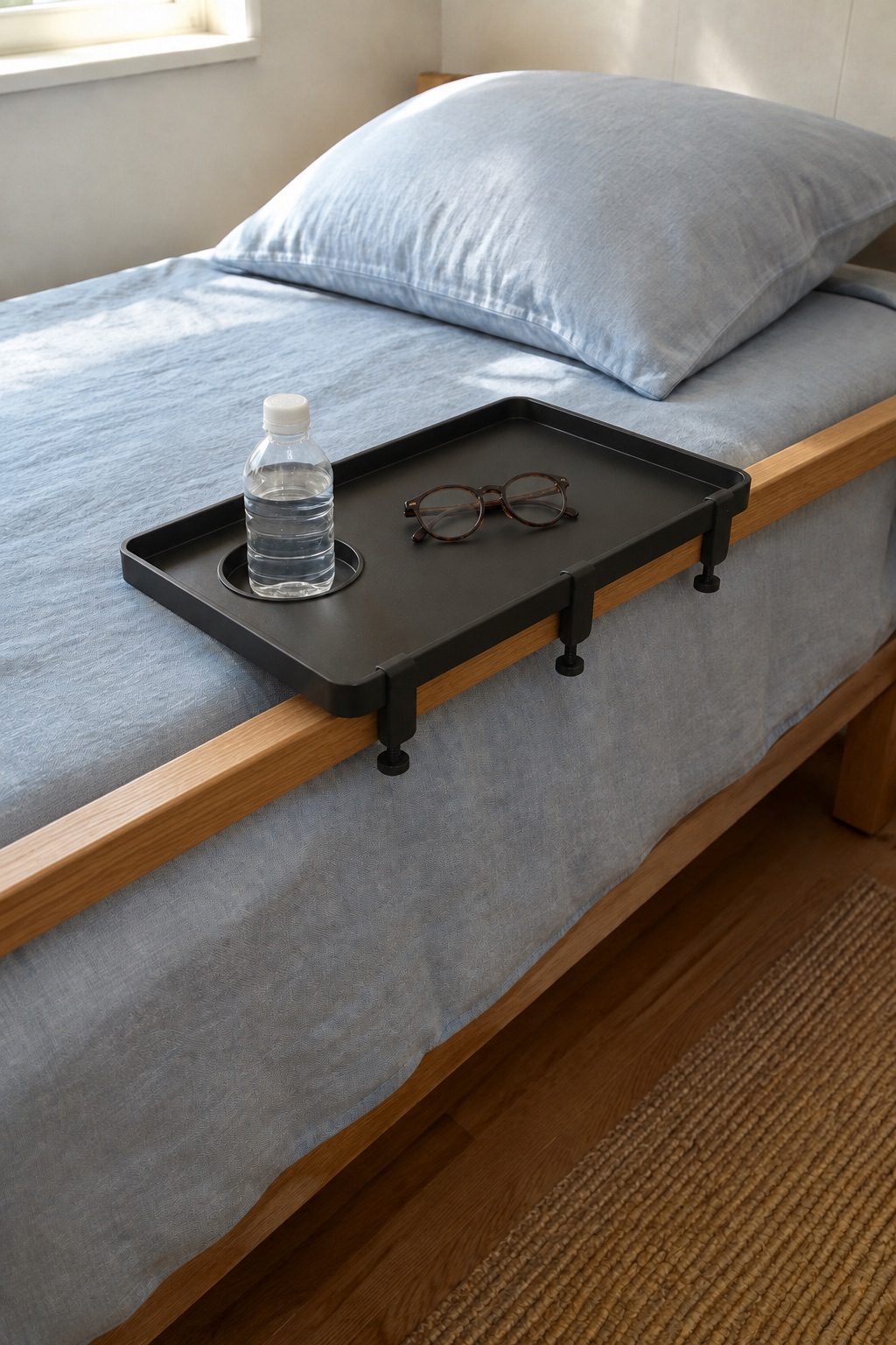 AI-generated visualization approximating the design of the Modern Innovations Bedside Tray, Black beside a bed.