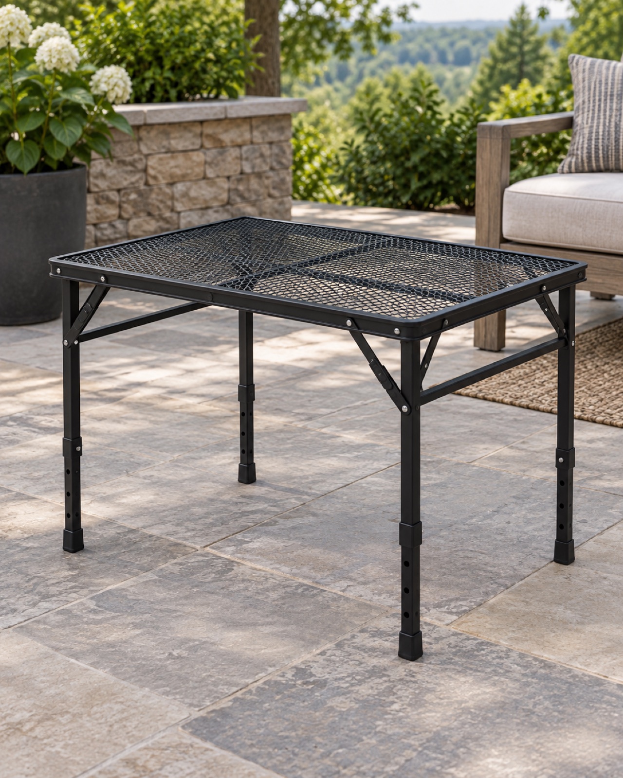 12 Compact Outdoor Side Tables for Small Patios and Balconies AI-generated visualization approximating the black EASTSTORM adjustable metal mesh folding table