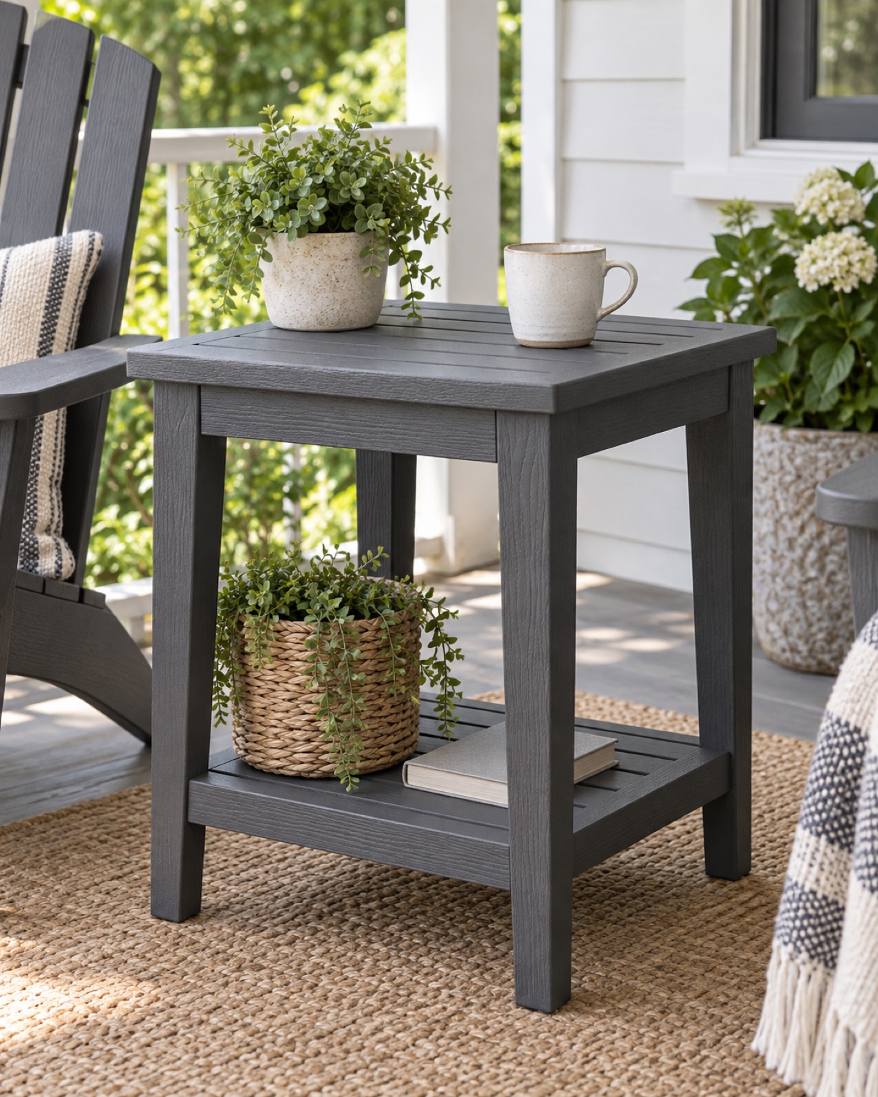 12 Compact Outdoor Side Tables for Small Patios and Balconies AI-generated visualization approximating the graphite Keter Deluxe Adirondack side table